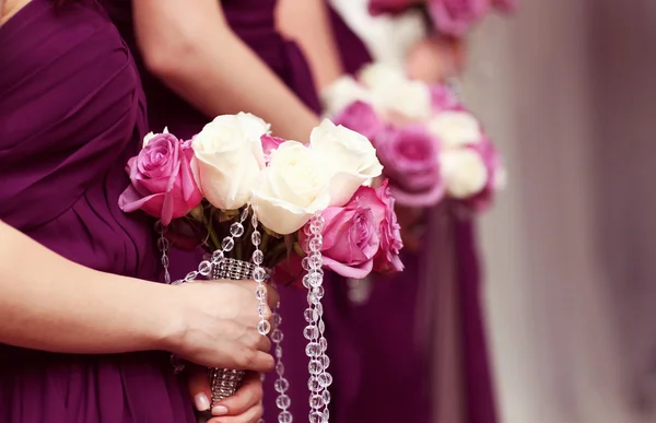 Bridesmaids holding beautiful bouquet of flowers — Stock Photo, Image