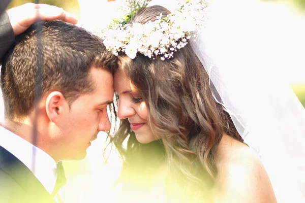 Joyful  bridal couple embracing on wedding day — Stock Photo, Image