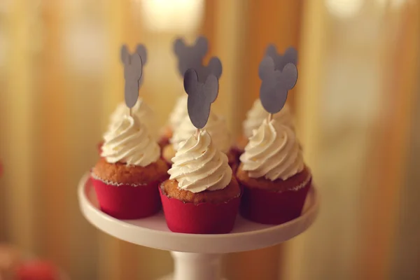 Delicious cupcakes on stand — Stock Photo, Image