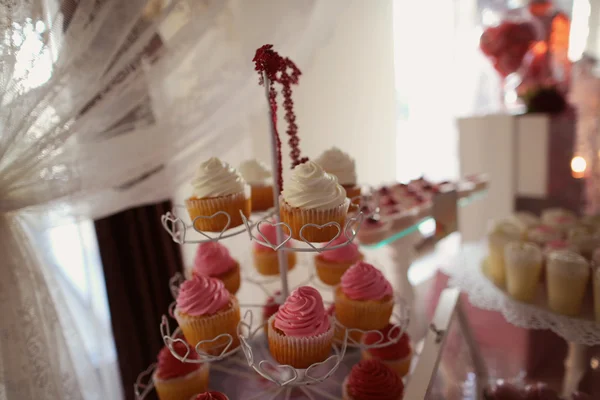 Delicious cupcakes on stand — Stock Photo, Image