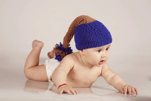 Cute little baby boy with winter hat on isolated background — Stock Photo, Image