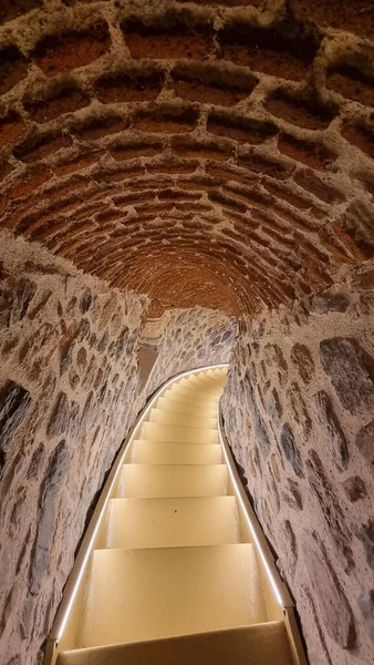 Brick tunnel with light steps
