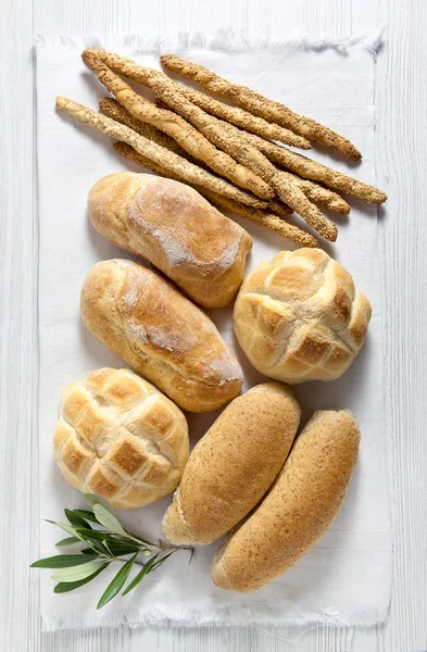 Fresh homemade Italian bread: ciabatta, wholemeal, turtle, gressini. breadsticks with sesame seeds — Stock Photo, Image