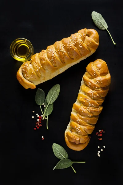 Fresh braided bread with sage and olive oil — Stock Photo, Image