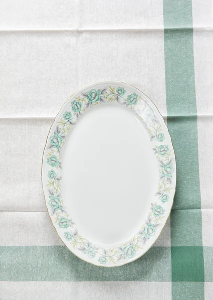 Oval plate with a pattern of flowers — Stock Photo, Image