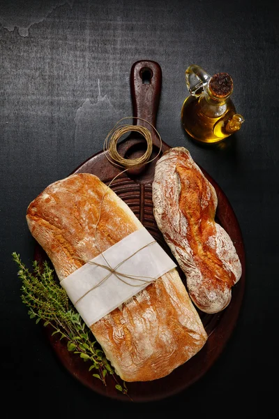 Italian ciabatta with herbs and olive oil — Stock Photo, Image