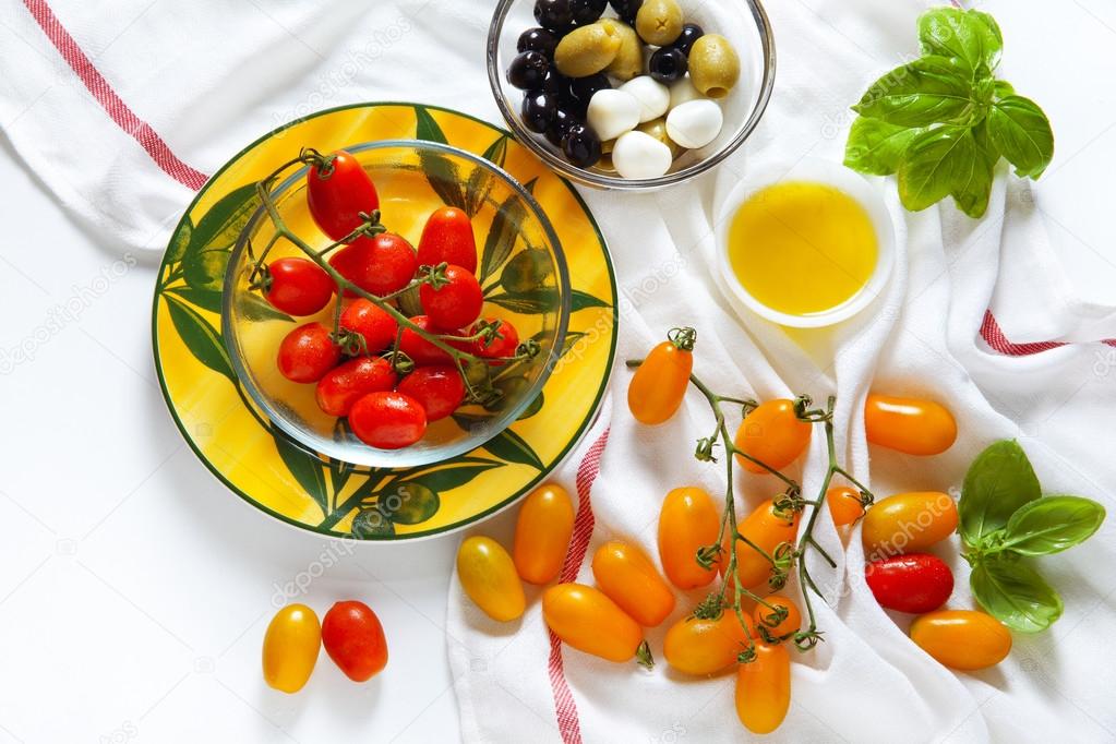 Sicilian red and yellow cherry tomatoes, green and black olives,
