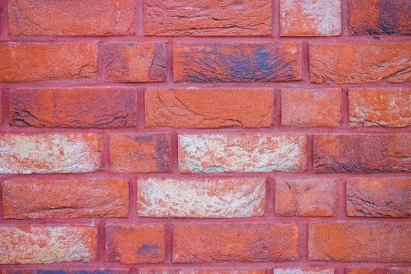 Decorative structural painted brick wall. Material for renovating home interiors and building facades. Decorative brick wall background with copy space.