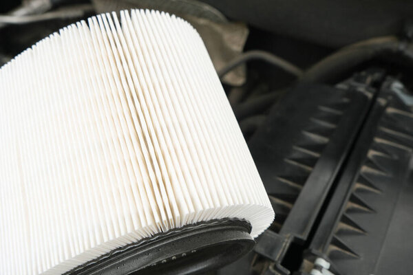 white new fresh Intake air filter, vehicle maintenance, car servicing and repair engine procedure, copy space for text