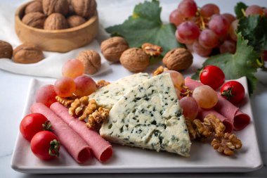 Sliced blue cheese - Roquefort cheese or gorgonzola cheese 