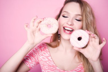 young girl eat sweet donut