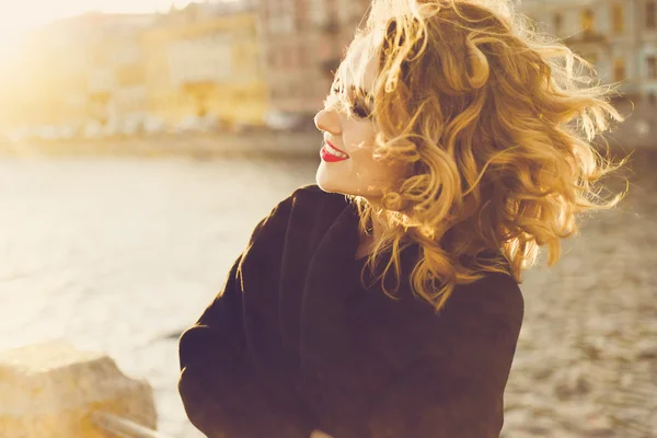 Stylish portrait of a beautiful young curly woman — Stock Photo, Image