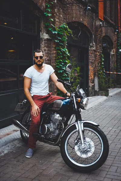 young guy posing sitting on motorcycle — Stock Photo © bublik_polina ...