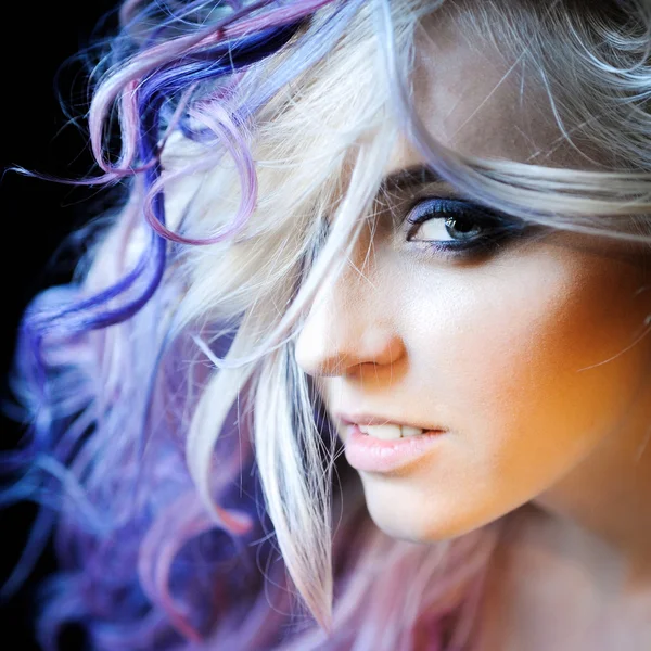 Beautiful sexy young blonde girl hipster with lilac and pink hair posing Stock Photo