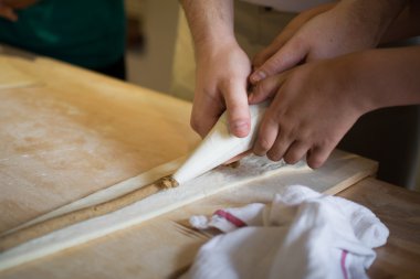 Making of rogal marcinski in Poznan (Poland)