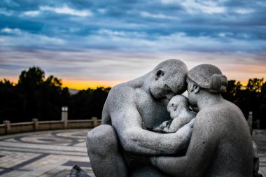 Sculptures in Vigeland sculpture park on amazing sunset, Oslo, Norway
