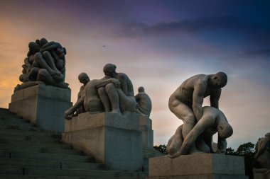 Sculptures in Vigeland sculpture park on amazing sunset, Oslo, Norway