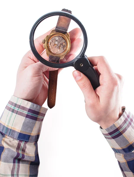 Looking at clock through loupe — Stock Photo, Image