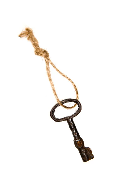 One old key from the door tied with rope — Stock Photo, Image