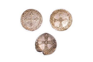 Vintage silver coins on a white background clipart