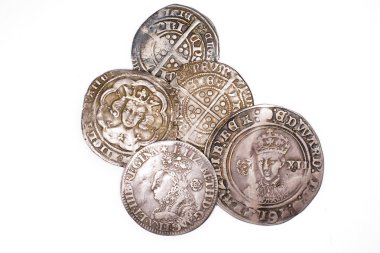 Antique England and  France Silver coins on white background clipart