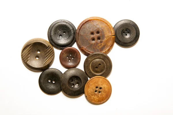 A lot of vintage buttons on  white background — Stock Photo, Image