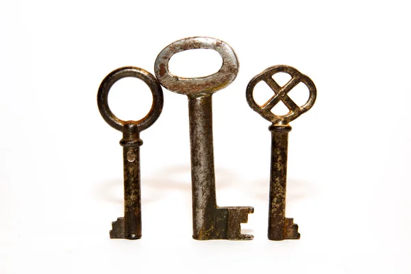 Three old keys to the safe on a white background — Stock Photo, Image