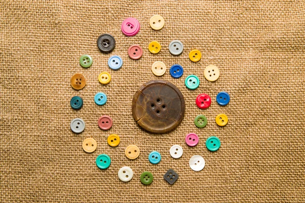 Many  vintage  buttons  on the old cloth — Stock Photo, Image