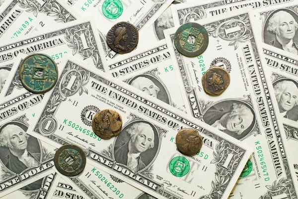 Antique  coins with portraits of emperors and banknotes of dolla — Stock Photo, Image