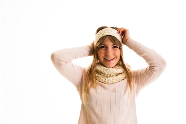 Girl in a sweater  smiling on a white background — Stock Photo, Image