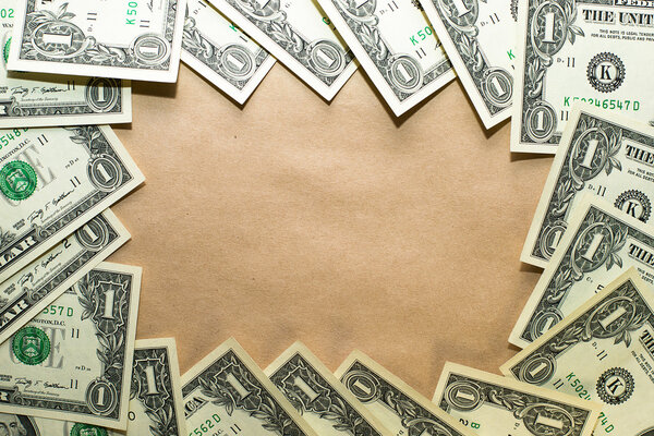 Banknotes dollars lined kraft paper in a circle