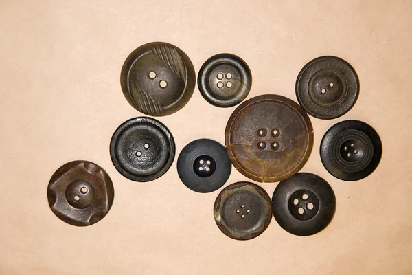 A lot of vintage  buttons  on the craft paper — Stock Photo, Image