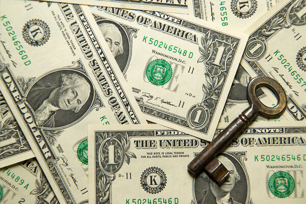 A lot of banknotes one US dollar and vintage key