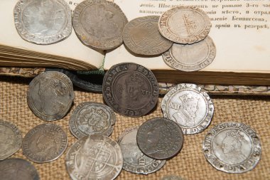 Ancient England silver coins with portraits of kings on the old  clipart