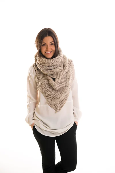 A girl in a grey knitted scarf smiling. Royalty Free Stock Photos