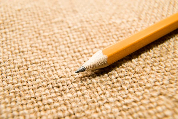 Desenho a lápis de madeira em um pano velho — Fotografia de Stock