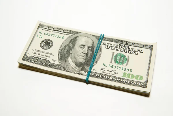 Bundle of US dollars banknotes on over white — Stock Photo, Image