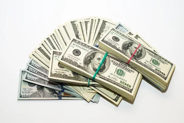 Bundles of US dollars and  banknotes on over white — Stock Photo, Image