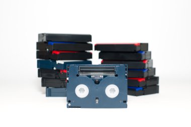 Many video cassettes are on over white clipart