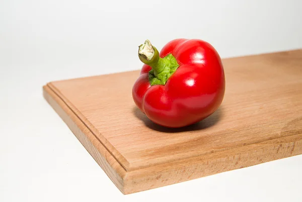 One ripe red peppers on over white — Stock Photo, Image