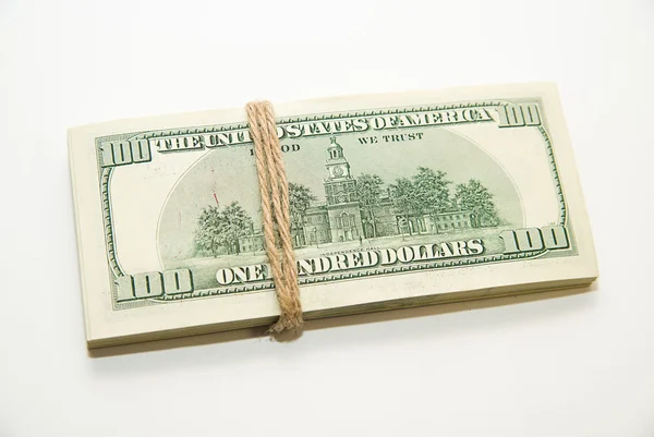 One pack of dollars on over white — Stock Photo, Image