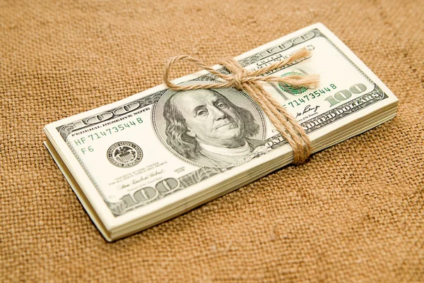 One pack of dollars on old cloth — Stock Photo, Image