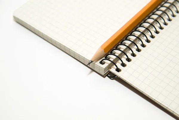 Opened notebook and pencil on over white — Stock Photo, Image