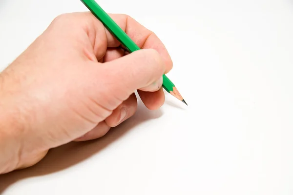 Men's left hand holding a pencil on over white — Stock Photo, Image