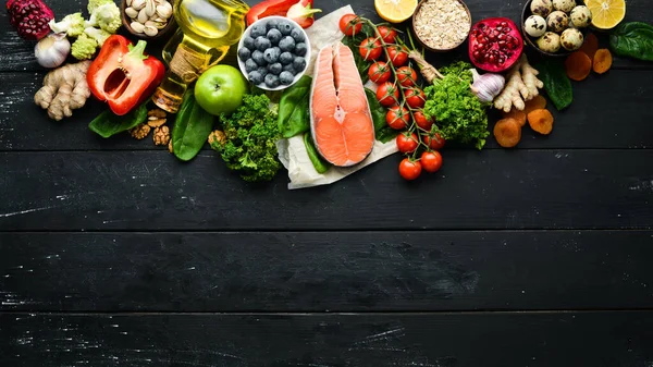 Healthy food for the heart. Dietary food. On a black stone background. Top view. Free copy space.