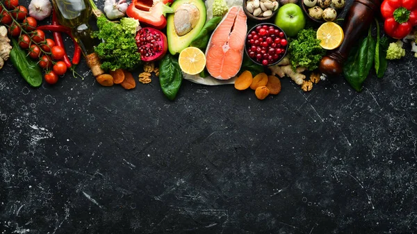 Healthy food for the heart. Dietary food. On a black stone background. Top view. Free copy space.