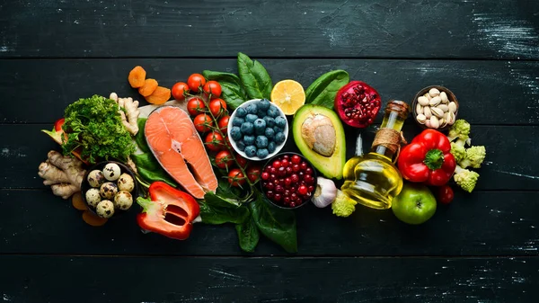 Healthy food for the heart. Dietary food. On a black stone background. Top view. Free copy space.