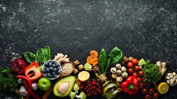 Healthy food for the heart. Dietary food. On a black stone background. Top view. Free copy space.