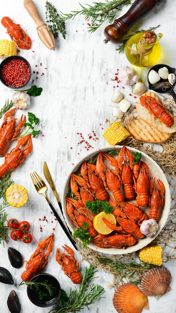 Crayfish. Red boiled crawfishes on table in rustic style, closeup. Lobster closeup. Seafood. Top view. Flat lay.