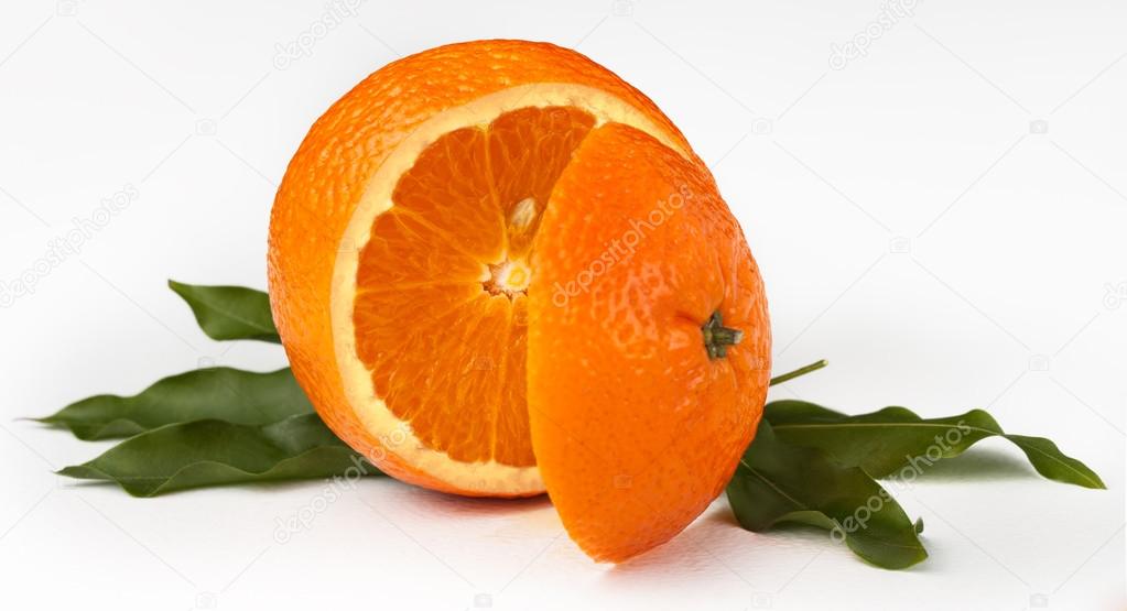 Cut the mandarin with leaves on white background